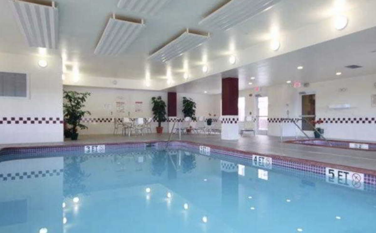 Palmdale Suites | Pool. Free Breakfast