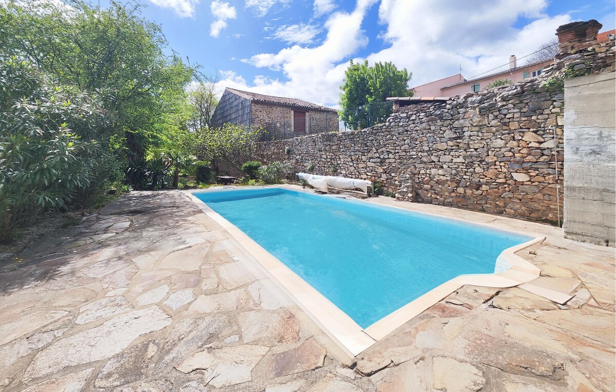 Lovely home in Faugères with outdoor swimming pool