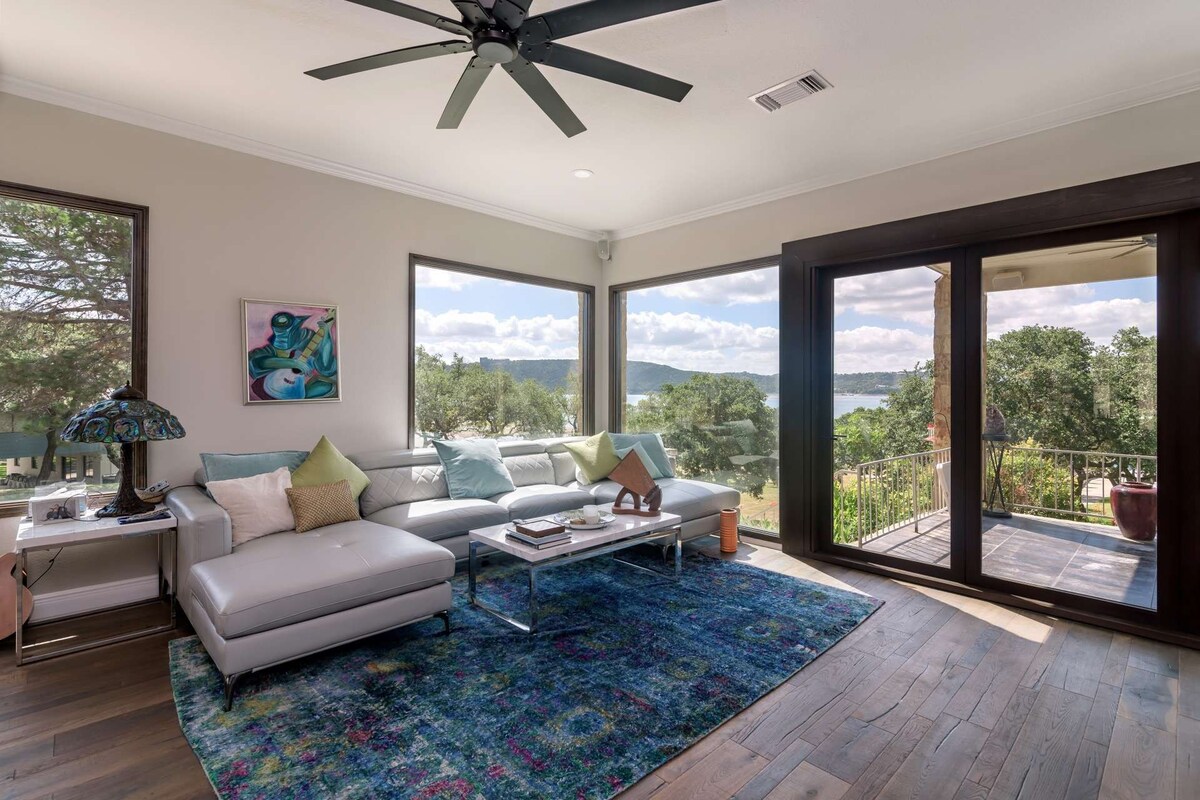 Lakefront Home with sand volleyball court by water