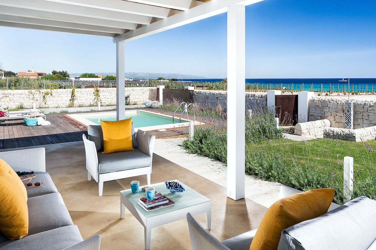 Private villa with sea view on a sandy beach