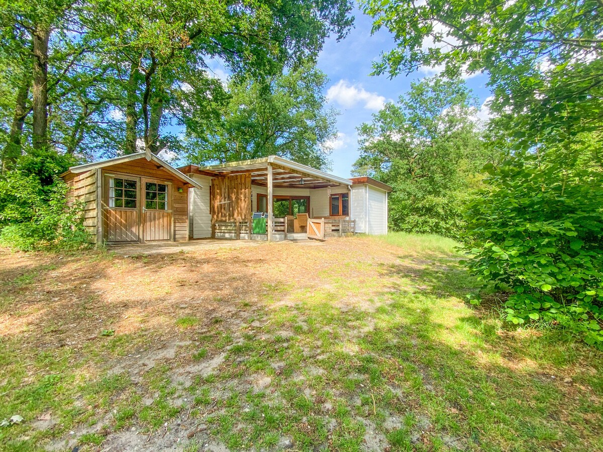 Chalet in the woods with veranda and sauna