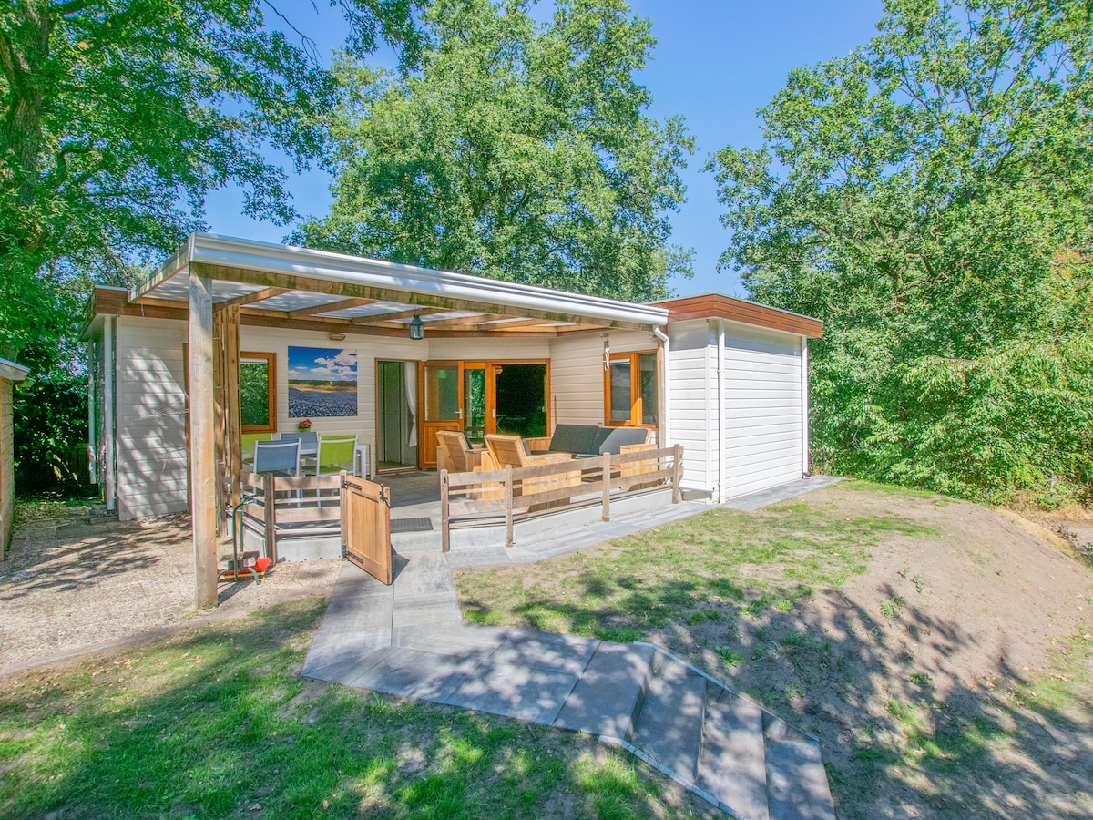 Chalet in the woods with veranda and sauna