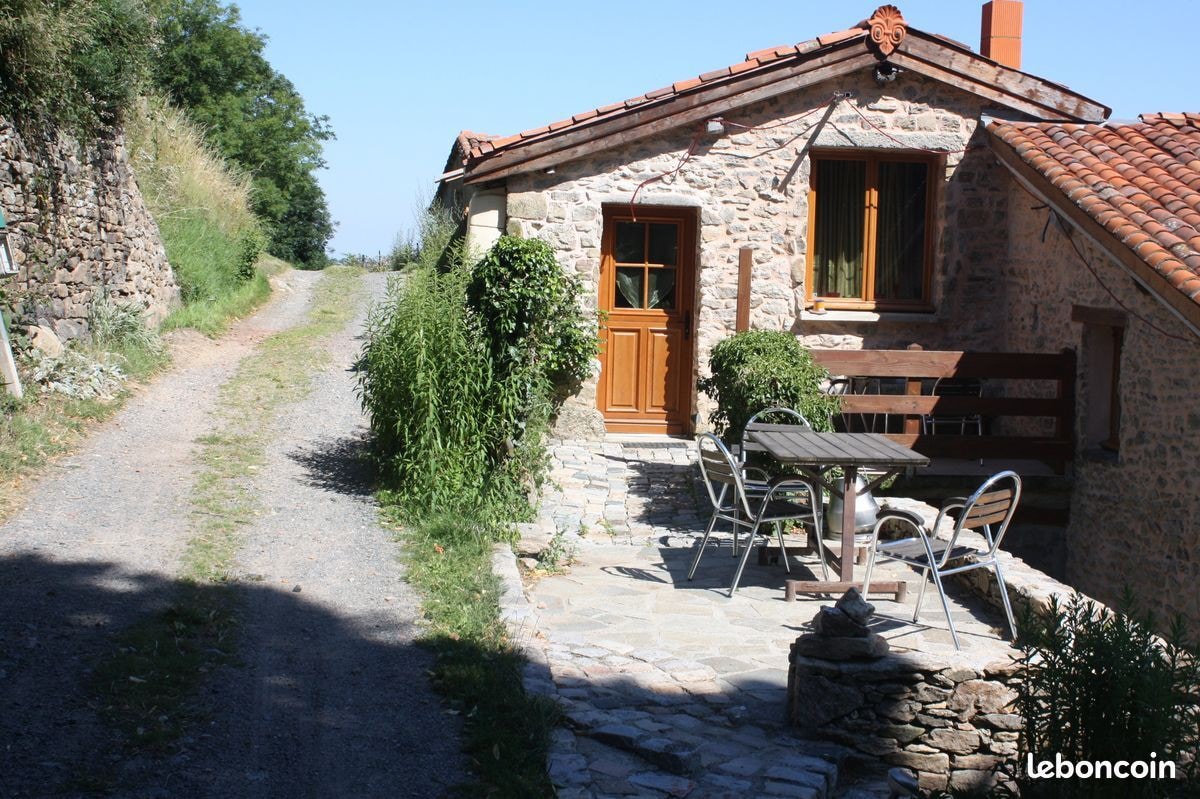 The yellow cottage, made of stone and wood