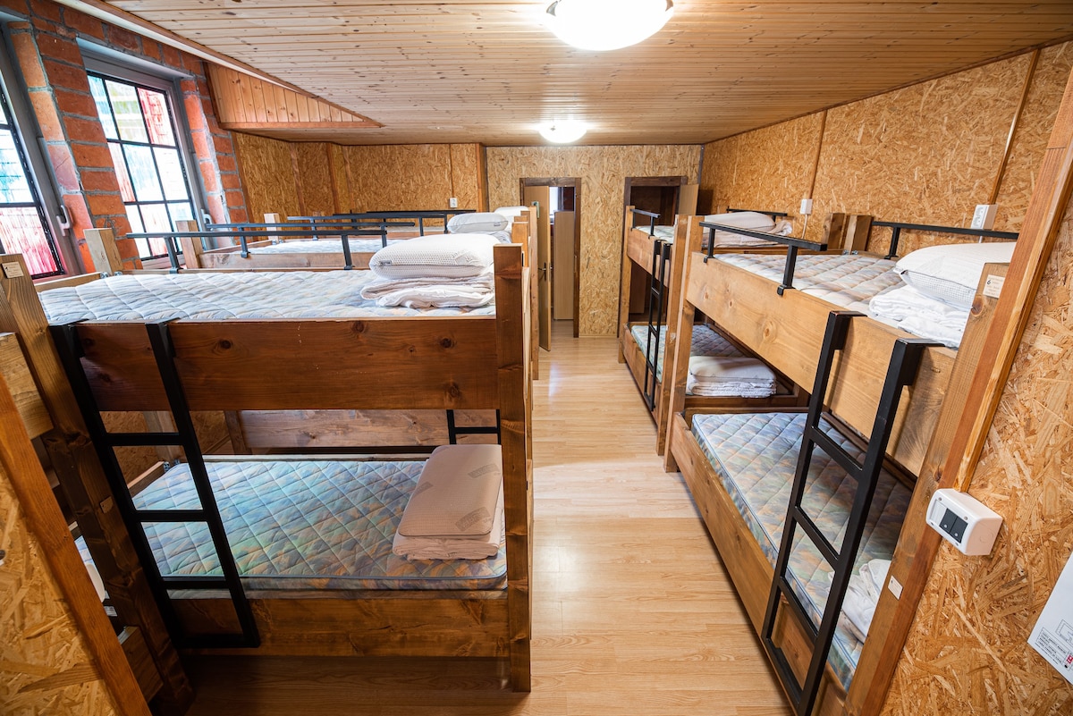 Bed in dormitory room in Tolmin