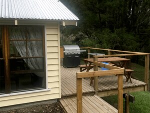 Off grid camping hut beside the river