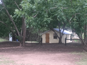 Off grid camping hut beside the river