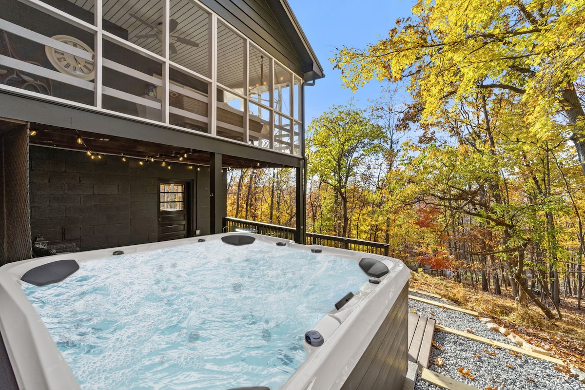Woodsy Retreat with a Hot Tub and Seasonal Views!