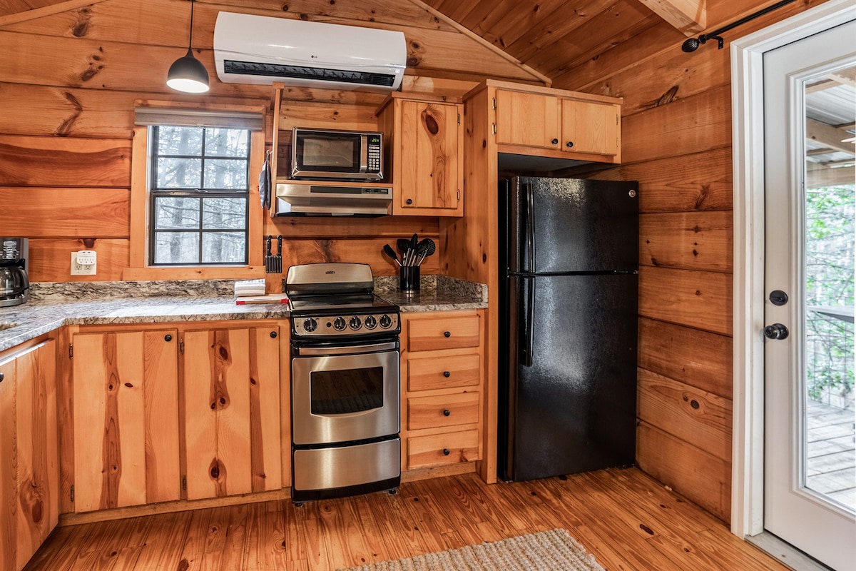 Wooded Couples Log Cabin w/ Hot Tub (Pet-friendly)