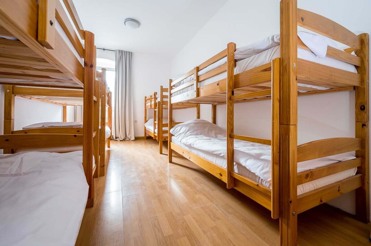 Comfortable Bed in Dorm Room in Log Pod Mangartom