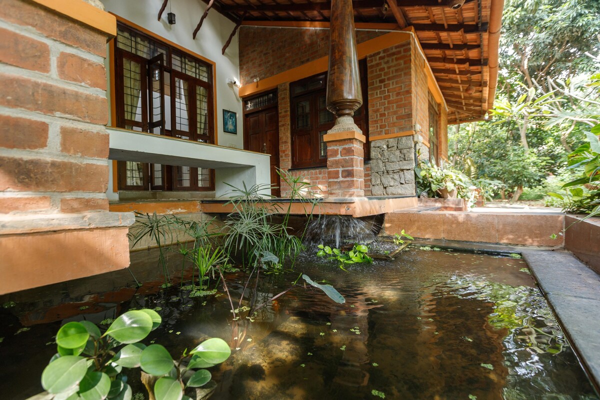 Kerala Style Villa by JadeCaps|AC|4BHK|Fishpond|