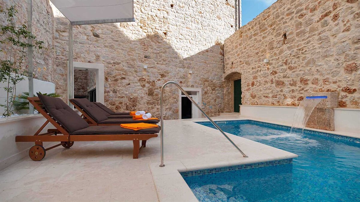 A traditional stone villa with swimming pool