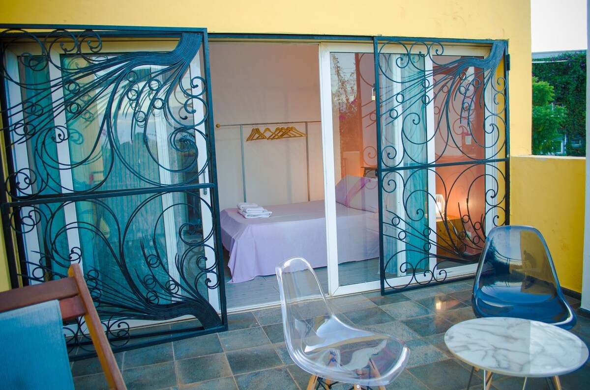 The white-orange bedroom with a pleasant view over