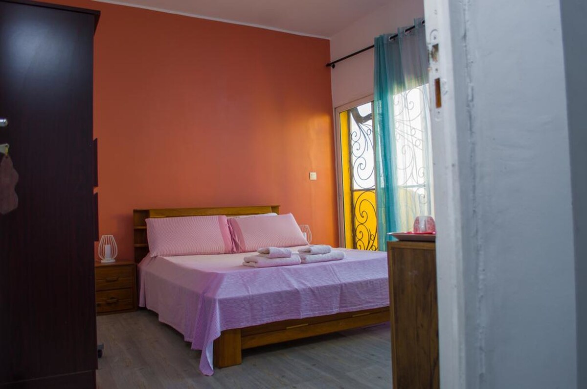 The white-orange bedroom with a pleasant view over