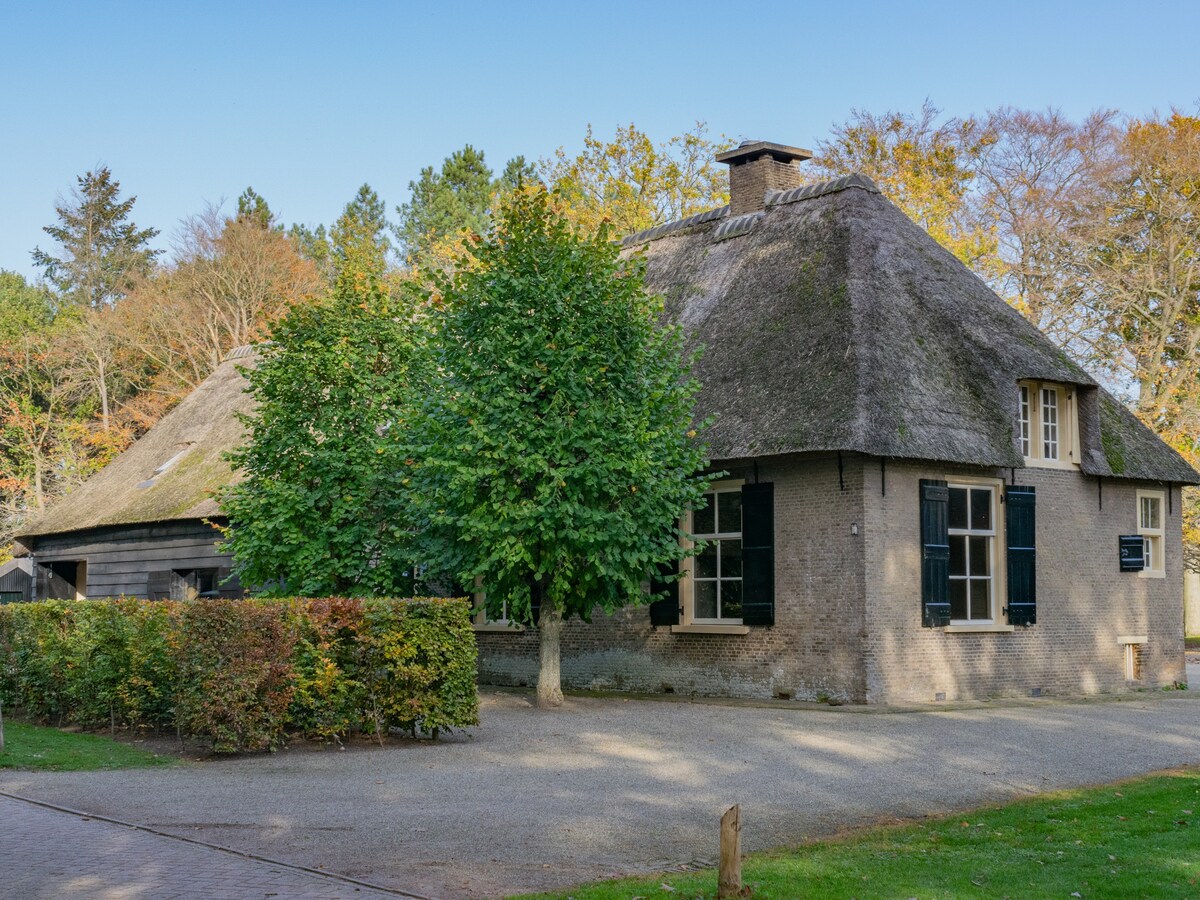 Thatched farmhouse in the forest