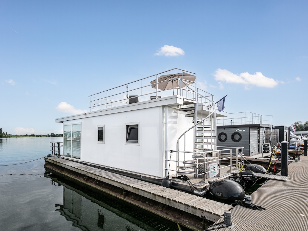 Modern houseboat with air conditioning in port