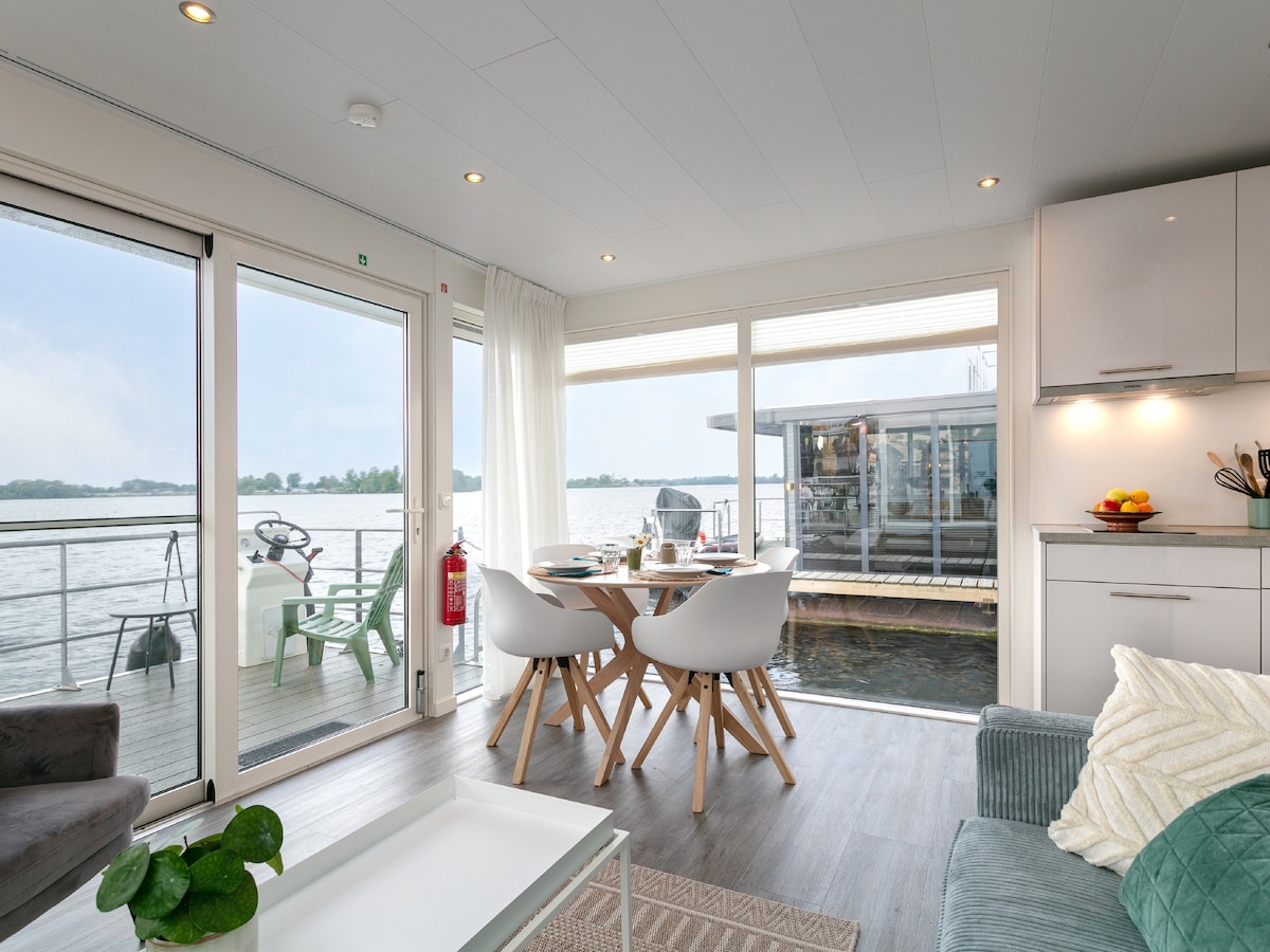 Modern houseboat with air conditioning in port