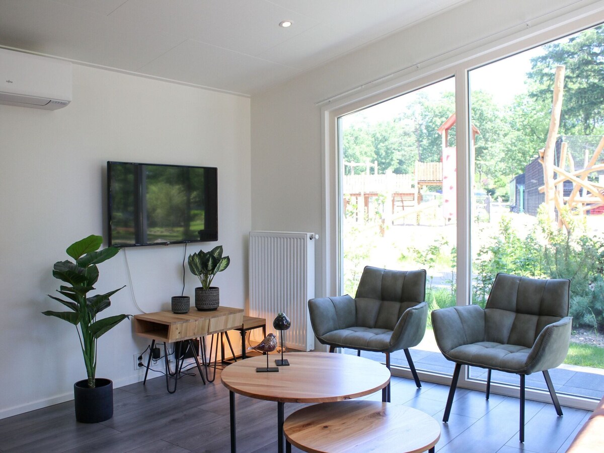 Modern chalet with AC, located at a playground