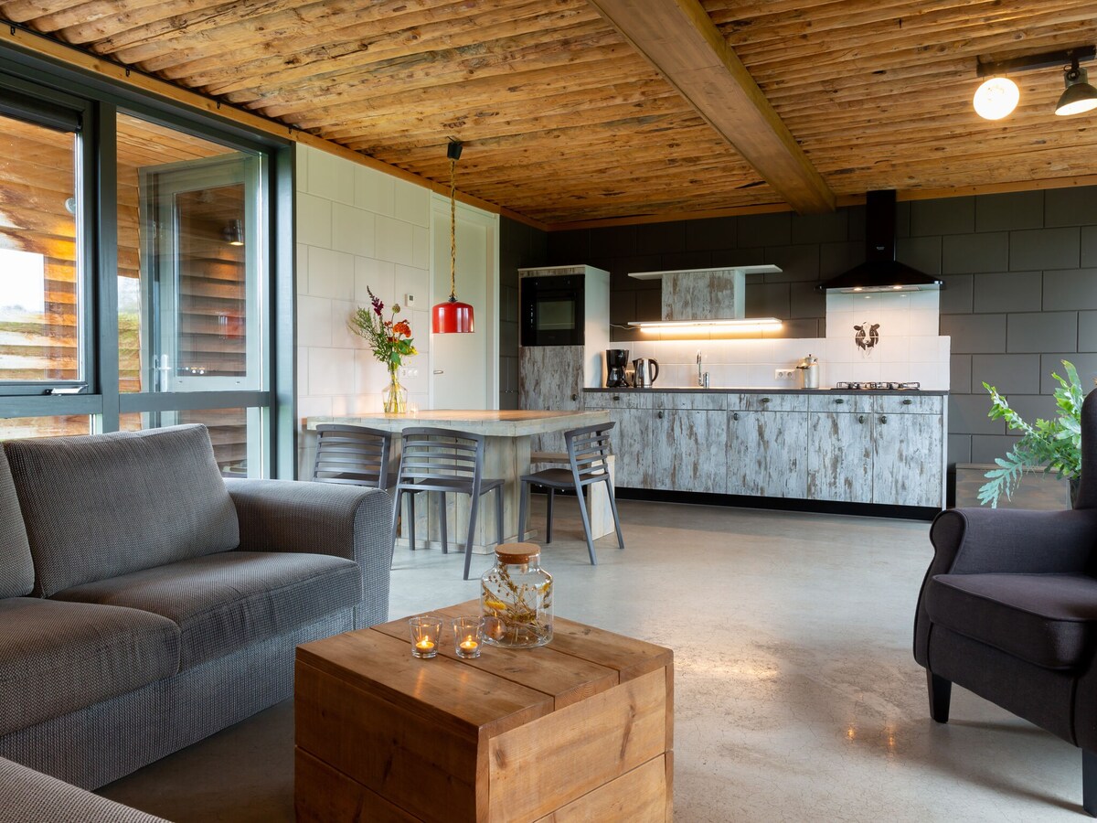 Bungalow with decorative fireplace, on farm