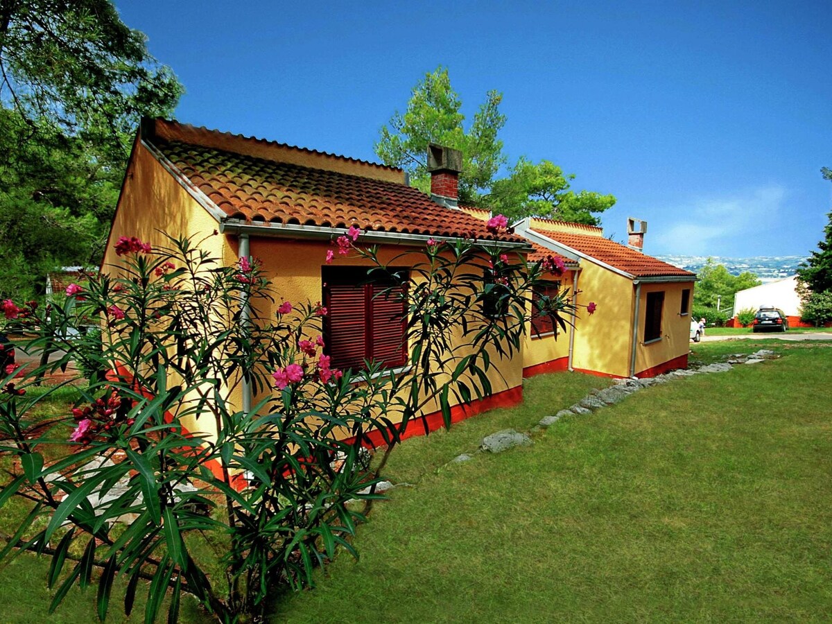 Bungalow with a balcony or terrace