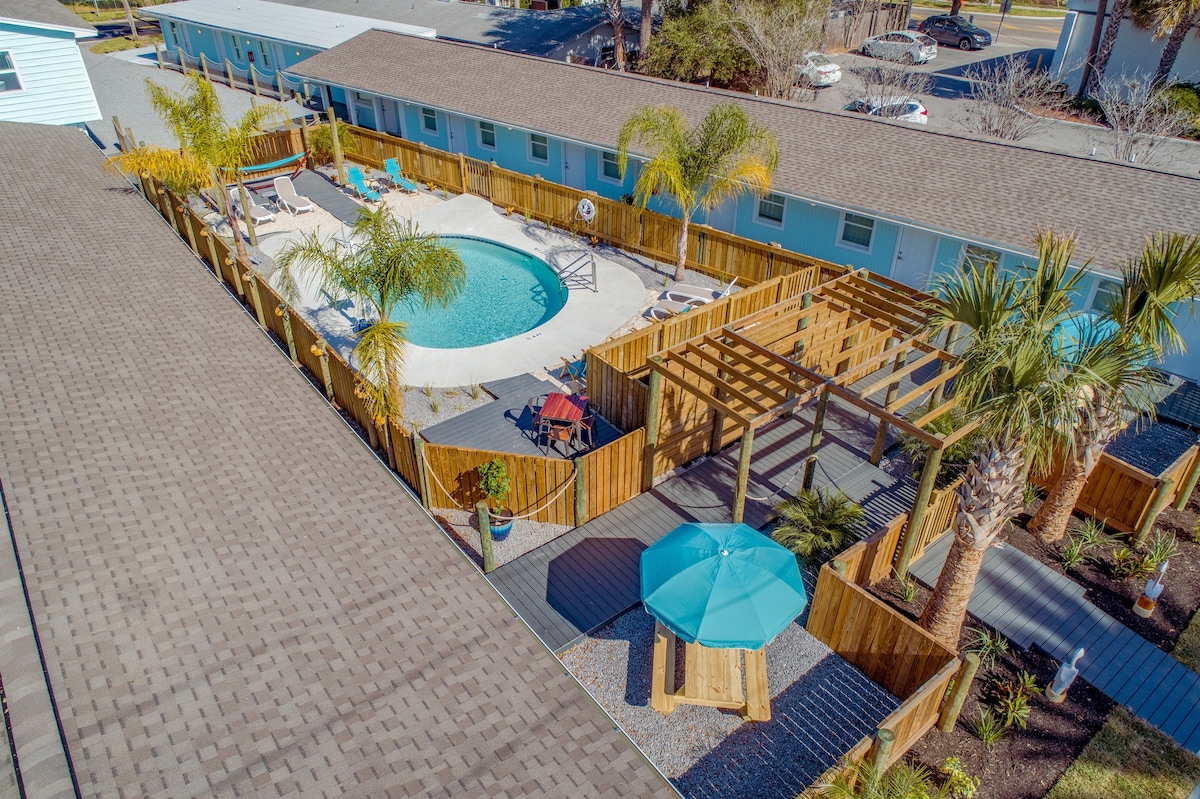 King Bedroom with shared tropical courtyard pool i